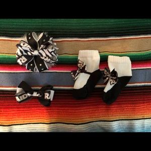 2 Raiders bows and 1 pair of baby Raider socks